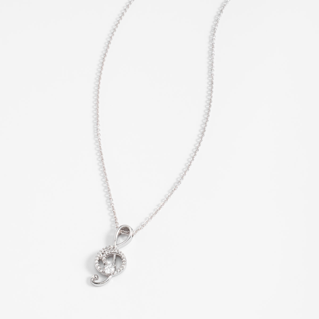 Collar en baño de platino con dije clave de sol y piedras