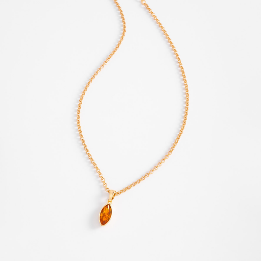 Collar en baño de oro con dije de piedra en tono ámbar