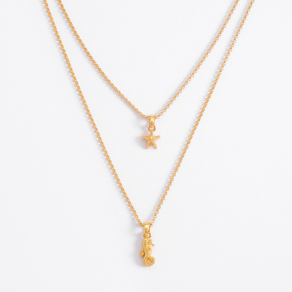 Collar doble cadena oro 18K estrella y caballito