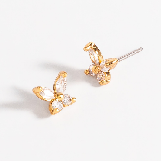 Aretes de botón mariposa en baño oro con piedras en tono cristal