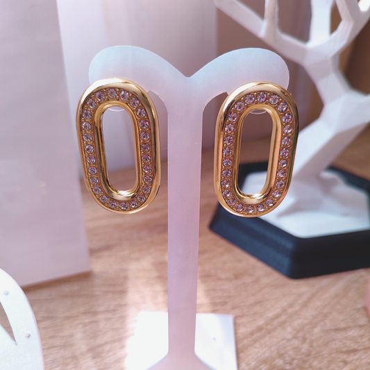 Aretes con piedras en tono cristal diseño oval